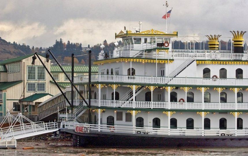 White and gold casino boat docked